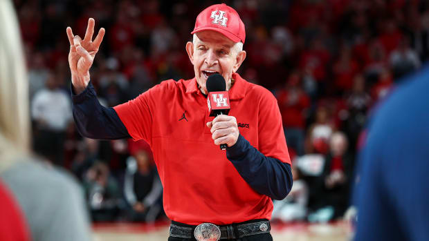 Jim “Mattress Mack” McIngvale leads the crowd in a cheer before the game between Houston and Temple at Fertitta Center.