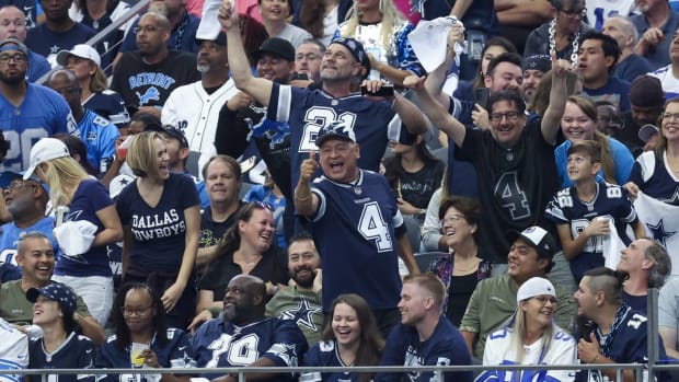 Cowboys fans celebrate in a game vs. the Lions.