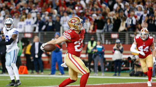 ANTA CLARA, CALIFORNIA - JANUARY 22: Christian McCaffrey #23 of the San Francisco 49ers celebrates after rushing for a touchdown against the Dallas Cowboys during the fourth quarter in the NFC Divisional Playoff game at Levi's Stadium on January 22, 2023 in Santa Clara, California.