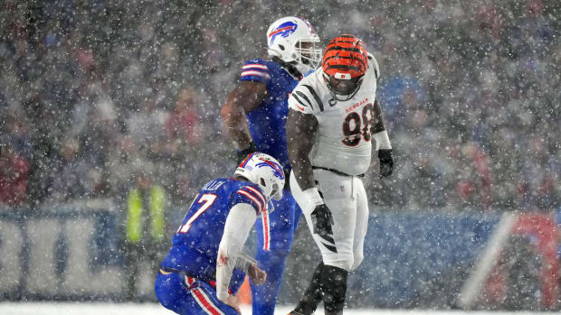 Cincinnati Bengals defensive tackle DJ Reader (98) checks on Buffalo Bills quarterback Josh Allen (17) after a hit in the fourth quarter during an NFL divisional playoff football game between the Cincinnati Bengals and the Buffalo Bills, Sunday, Jan. 22, 2023, at Highmark Stadium in Orchard Park, N.Y. Cincinnati Bengals At Buffalo Bills Afc Divisional Jan 22 1304