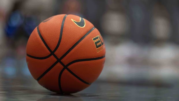 A close-up view of a basketball on a court before a game.