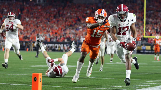 Alabama Crimson Tide running back Kenyan Drake (17) gets past Clemson Tigers safety T.J. Green (15) to score a touchdown on a kick return during the fourth quarter in the 2016 CFP National Championship
