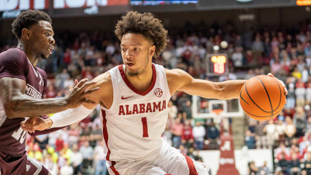 Alabama Crimson Tide guard Mark Sears (1) drives to the basket against Mississippi State Bulldogs guard Dashawn Davis (10) during the second half at Coleman Coliseum.
