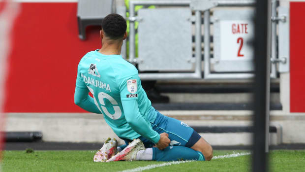 Arnaut Danjuma pictured celebrating a goal for Bournemouth in a 2021 EFL Championship play-off semi-final against Brentford