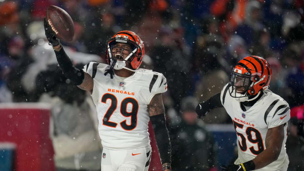 Cincinnati Bengals cornerback Cam Taylor-Britt (29) celebrates after intercepting a pass to seal a Bengals win in the fourth quarter of the NFL divisional playoff football game between the Cincinnati Bengals and the Buffalo Bills, Sunday, Jan. 22, 2023, at Highmark Stadium in Orchard Park, N.Y. The Bengals won 27-10 to advance to the AFC Championship game against the Kansas City Chiefs. Cincinnati Bengals At Buffalo Bills Afc Divisional Jan 22 227 Syndication The Enquirer