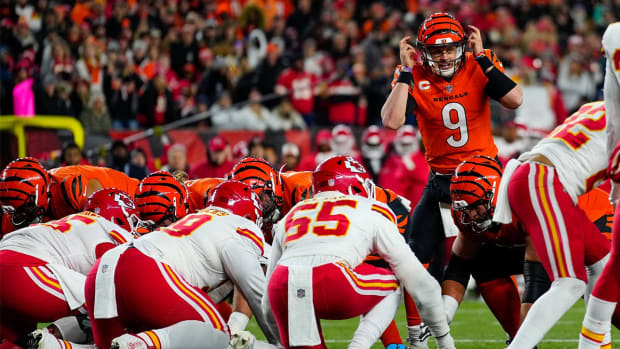 Dec 4, 2022; Cincinnati, Ohio, USA; Cincinnati Bengals quarterback Joe Burrow (9) makes an adjustment as the Bengals go for it on 4th and 1 in the second quarter of a Week 13 NFL game at Paycor Stadium.