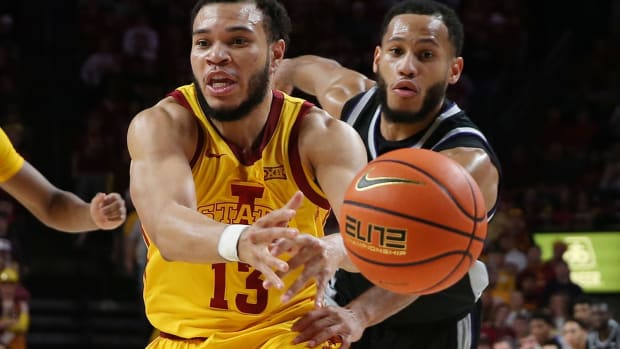Iowa State University Cyclones guard Jaren Holmes (13) and Kansas State Wildcats guard Markquis Nowell (1) battle for the ball during the second half at Hilton Coliseum Tuesday, 2023, in Ames, Iowa.