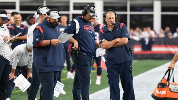 Aug 11, 2022; Foxborough, Massachusetts, USA; New England Patriots head coach Bill Belichick watches the field as senior football advisor Matt Patricia (white cap) and offensive assistant Joe Judge work during the first half of a preseason game at Gillette Stadium.
