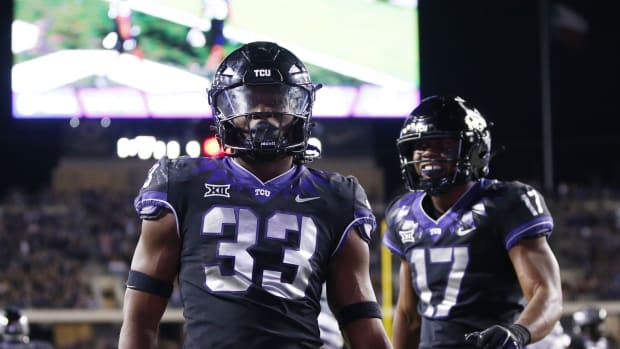 Oct 22, 2022; Fort Worth, Texas, USA; TCU Horned Frogs running back Kendre Miller (33) celebrate scoring a touchdown against the Kansas State Wildcats in the fourth quarter at Amon G. Carter Stadium. Mandatory Credit: Tim Heitman-USA TODAY Sports