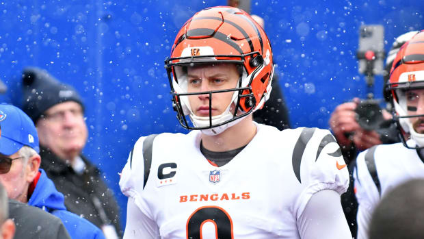 Bengals quarterback Joe Burrow (9) walks on the field before an AFC divisional round game against the Bills.