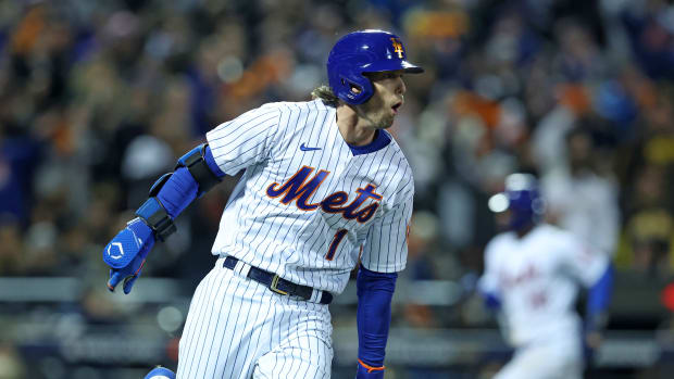 Oct 8, 2022; New York City, New York, USA; New York Mets second baseman Jeff McNeil (1) reacts after hitting a two run double against the San Diego Padres in the seventh inning during game two of the Wild Card series for the 2022 MLB Playoffs at Citi Field.