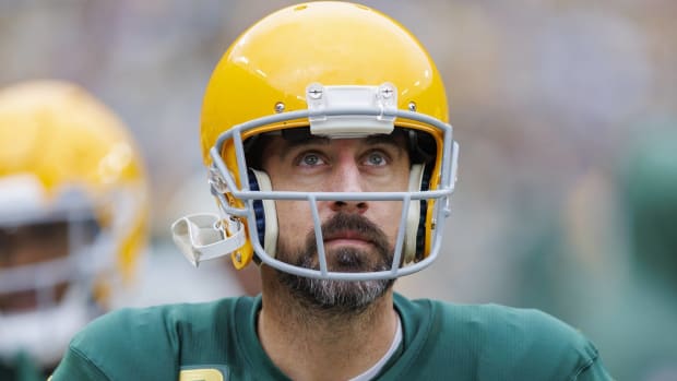 Packers quarterback Aaron Rodgers looks on during a game.