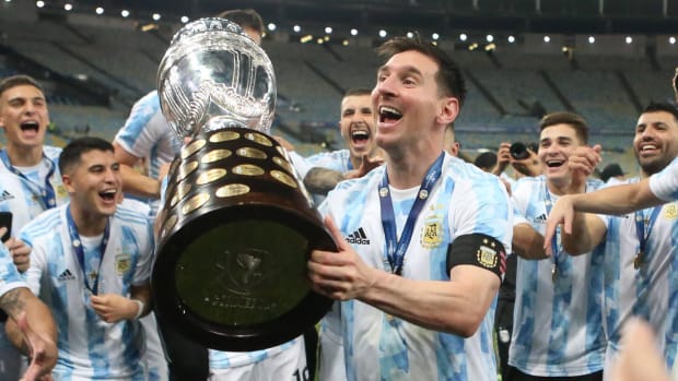 Argentina’s Lionel Messi lifts the trophy after winning Copa América 2021.