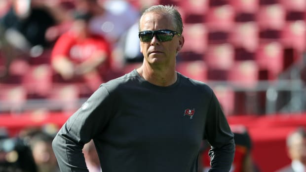 Former Buccaneers offensive coordinator Todd Monken stands with his hand on his hips prior to a game.
