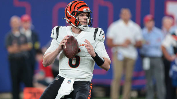 Bengals quarterback Jake Browning drops back to pass in a preseason game vs. the Giants.