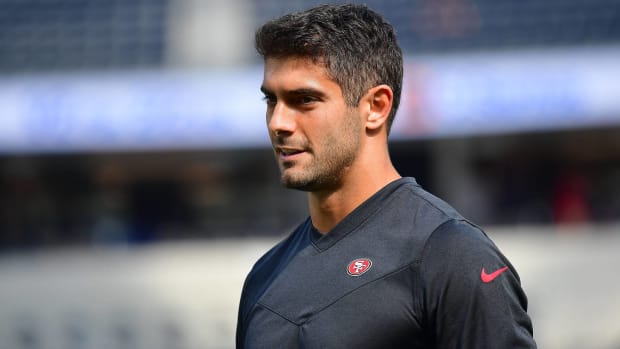 49ers quarterback Jimmy Garoppolo looks on before a game vs. the Rams