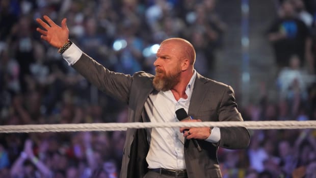 Triple H speaks to a crowd during Wrestlemania in Dallas.
