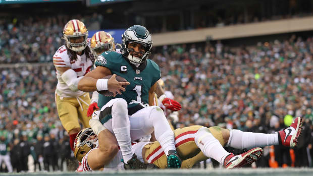Jan 29, 2023; Philadelphia, Pennsylvania, USA; Philadelphia Eagles quarterback Jalen Hurts (1) is tackled by San Francisco 49ers defensive end Nick Bosa (97) during the second quarter in the NFC Championship game at Lincoln Financial Field. Mandatory Credit: Bill Streicher-USA TODAY Sports