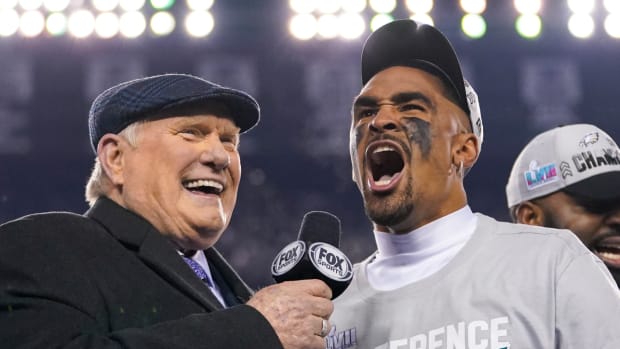 Eagles quarterback Jalen Hurts sings with Fox analyst Terry Bradshaw after the NFC championship win.