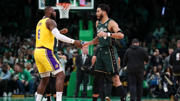 Jan 28, 2023; Boston, Massachusetts, USA; Boston Celtics forward Jayson Tatum (0) and Los Angeles Lakers forward LeBron James (6) react before playing at TD Garden.
