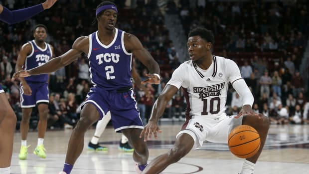 Mississippi State Bulldogs guard Dashawn Davis (10) dribbles as TCU Horned Frogs forward Emanuel Miller (2) defends during the second half at Humphrey Coliseum.