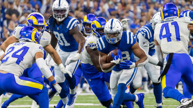 Sep 19, 2021; Indianapolis, Indiana, USA; Indianapolis Colts running back Jonathan Taylor (28) runs the ball in the first quarter against the Los Angeles Rams at Lucas Oil Stadium.