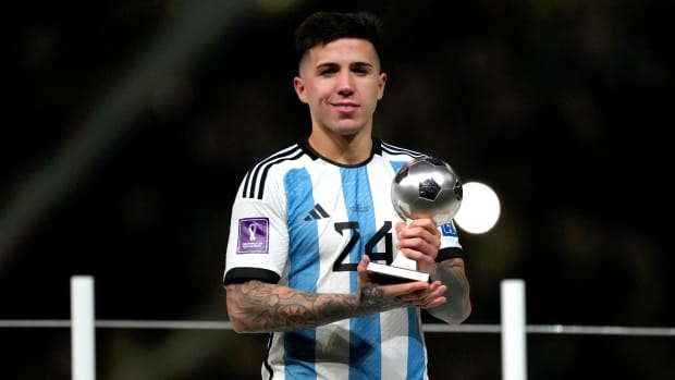Argentina’s Enzo Fernández holds up the World Cup’s Best Young Player Award.