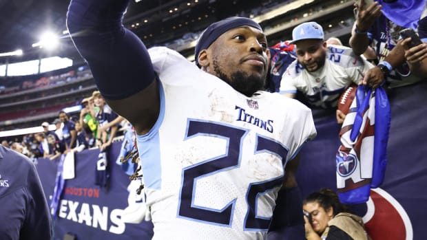 Fans cheer as Tennessee Titans running back Derrick Henry (22) runs off the field after the game against the Houston Texans at NRG Stadium.