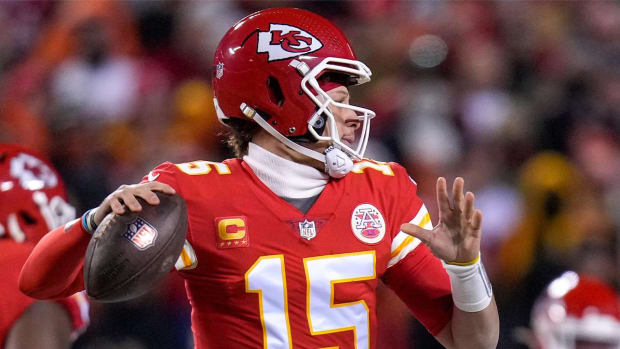 Chiefs quarterback Patrick Mahomes throws on the run in the first quarter.