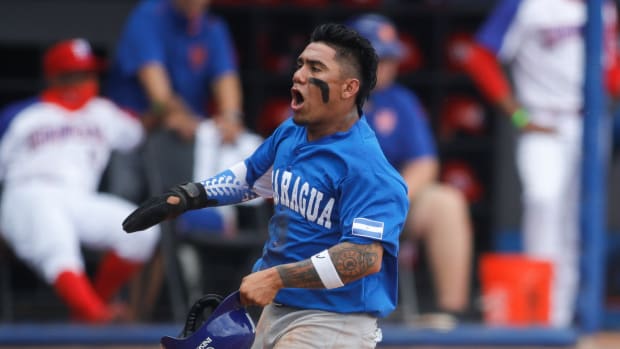 SF Giants center fielder Ismael Munguia (13) reacts after scoring a run in the first inning of a game during the WBSC Baseball Americas Qualifier series for Nicaragua. (2021)