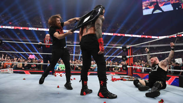 Sami Zayn hits Roman Reigns with a chair at the Royal Rumble