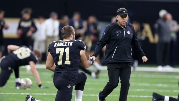 New Orleans Saints head coach Sean Payton shakes hands with offensive tackle Ryan Ramczyk (71) before their game against the Chicago Bears at the Mercedes-Benz Superdome.