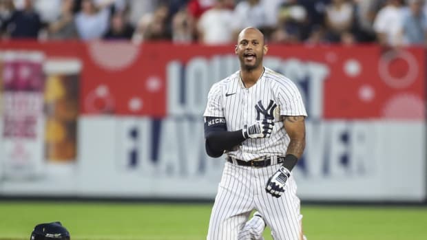 New York Yankees OF Aaron Hicks reacts to being tagged out