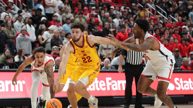 Jan 30, 2023; Lubbock, Texas, USA; Iowa State Cyclones guard Gabe Kalscheur (22) brings the ball up court against Texas Tech Red Raiders forward KJ Allen (5) and guard Jaylon Tyson (20) in the first half at United Supermarkets Arena.