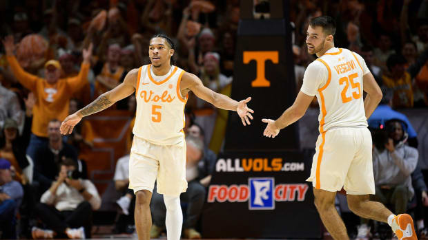 Tennessee guard Zakai Zeigler (5) congratulates Tennessee guard Santiago Vescovi (25) on a play during a game between Tennessee and Texas at Thompson-Boling Arena in Knoxville, Tenn., on Saturday, Jan. 28, 2023.