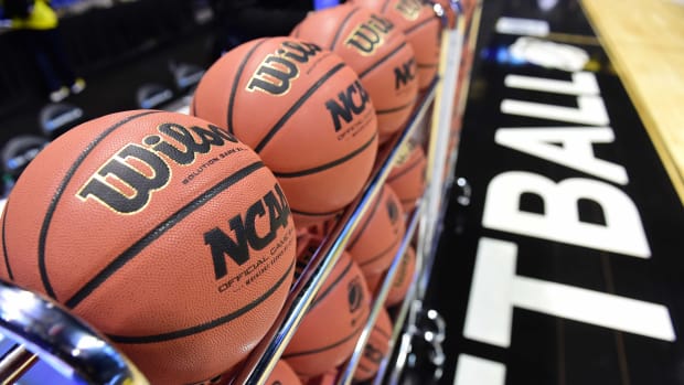 A general, close-up view of NCAA basketballs on a rack during a practice.