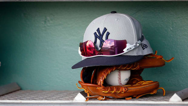 New York Yankees hat rests on glove in spring training