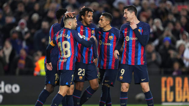 Players from Barcelona pictured celebrating during a 3-0 win over Sevilla in February 2023