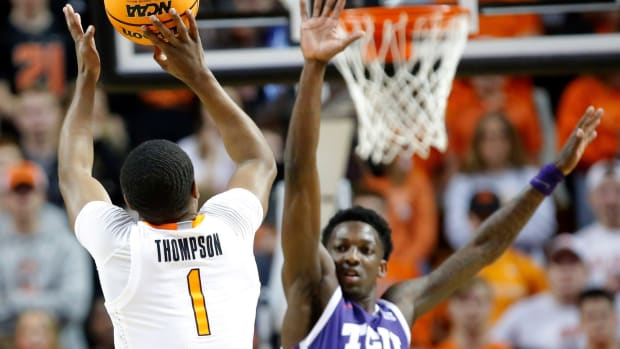 Oklahoma State's Bryce Thompson (1) shoots over Damion Baugh (10) in the first half during the men's college basketball game between the Oklahoma State Cowboys and TCU Horned Frogs