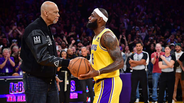 Los Angeles Lakers forward LeBron James (6) shakes hands with former player Kareem Abdul-Jabbar after breaking the NBA all time scoring record against the Oklahoma City Thunder during the second half at Crypto.com Arena.