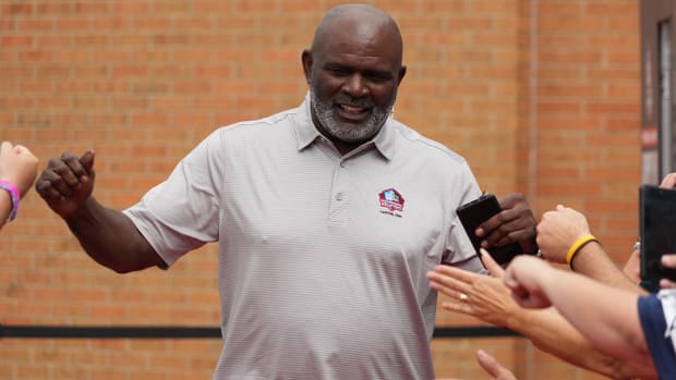 Lawrence Taylor arrives on the red carpet during the Pro Football Hall of Fame Class of 2022 Enshrinement at Tom Benson Hallof Fame Stadium.