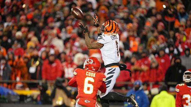 Jan 29, 2023; Kansas City, Missouri, USA; Cincinnati Bengals wide receiver Ja'Marr Chase (1) makes a catch against Kansas City Chiefs safety Bryan Cook (6) during the third quarter of the AFC Championship game at GEHA Field at Arrowhead Stadium. Mandatory Credit: Jay Biggerstaff-USA TODAY Sports