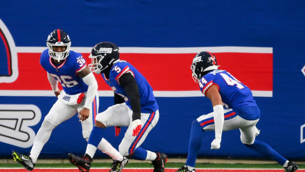 Dec 4, 2022; East Rutherford, New Jersey, USA; New York Giants defensive end Kayvon Thibodeaux (5) celebrates his sack with safety Tony Jefferson (36) and cornerback Nick McCloud (44) against the Washington Commanders during overtime at MetLife Stadium.