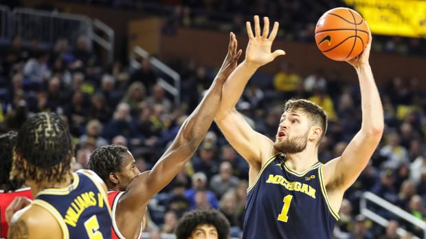 Michigan center Hunter Dickinson (1) goes to the basket against Ohio State during the second half at Crisler Center in Ann Arbor on Sunday, Feb. 5, 2023.