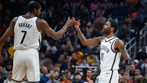 Brooklyn Nets forward Kevin Durant (7) and guard Kyrie Irving (11) celebrate a made shot in the second quarter against the Indiana Pacers at Gainbridge Fieldhouse.
