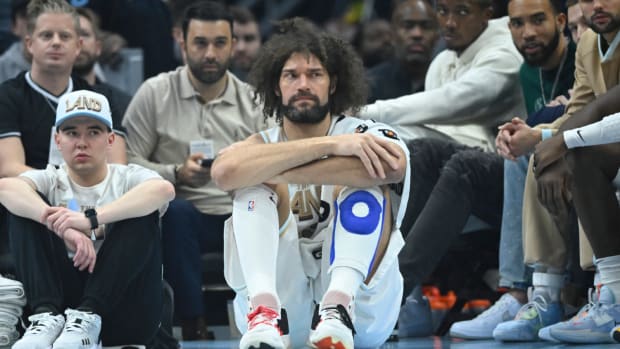 Robin Lopez sits waiting to go into a game for the Cavaliers.