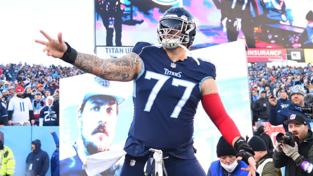 Titans offensive tackle Taylor Lewan (77) takes the field before the game against the Bengals.