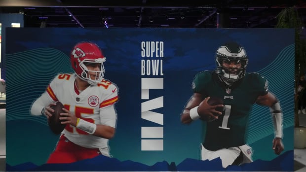 A graphic featuring Kansas City Chiefs quarterback Patrick Mahomes and Philadelphia Eagles quarterback Jalen Hurts at the Super Bowl LVII Experience at the Phoenix Convention Center.