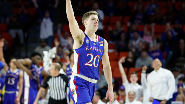 Feb 11, 2023; Norman, Oklahoma, USA; Kansas Jayhawks guard Michael Jankovich (20) gestures after scoring a three point basket against the Oklahoma Sooners during the second half at Lloyd Noble Center. Kansas won 78-55.