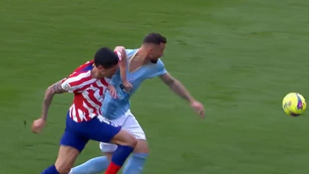 Stefan Savic pictured (left) pulling the jersey of Celta Vigo striker Haris Seferovic during Atletico Madrid's 1-0 win in February 2023